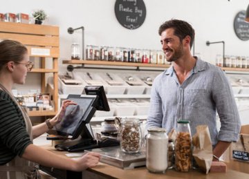 A person purchasing a coffee